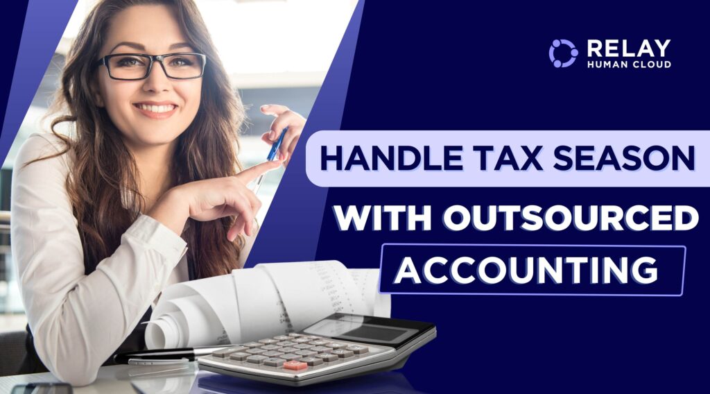 Accountant in formal attire working on her desk in an office with documents and a calculator in front of her.