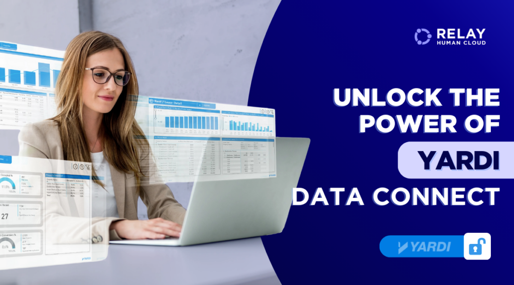 Female corporate employee working in a formal attire on a silver laptop on her desk.